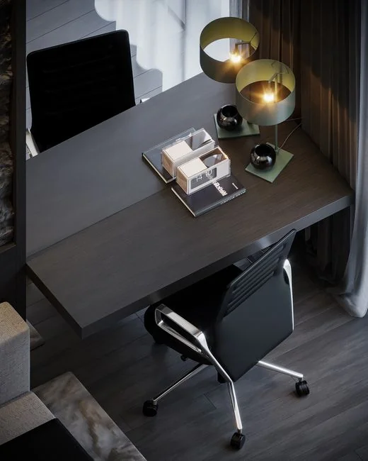 Close-up of an artist designing fashion sketches while seated at a desk indoors.
